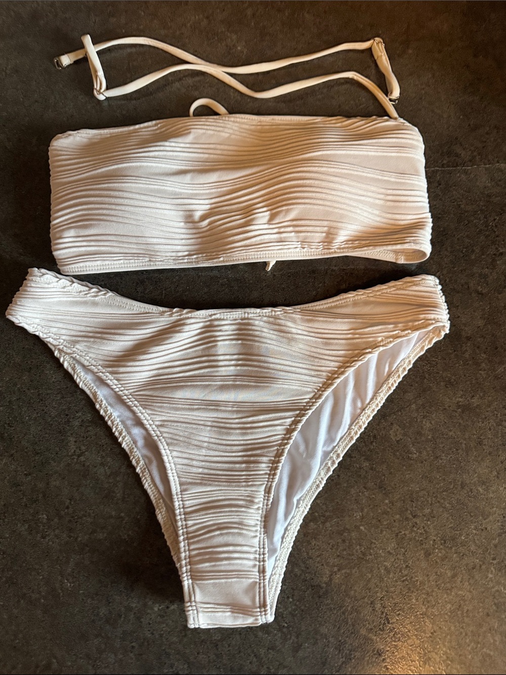 Never worn two piece cream bikini. Can be worn as bandeau or with straps